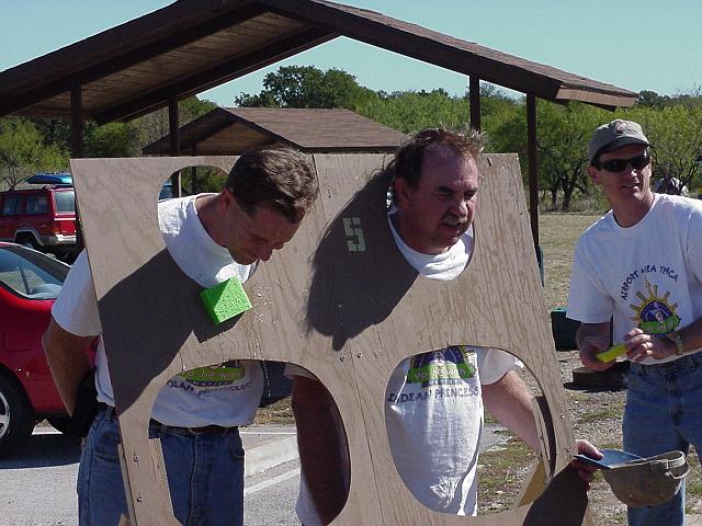 Steve Mills and Dick Nenow getting pounded with wet spongses.JPG